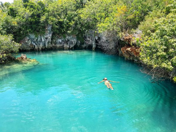 Person swimming in Blue hole