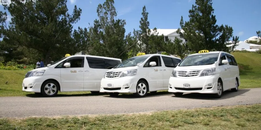 3 WHITE TAXI PARKED
